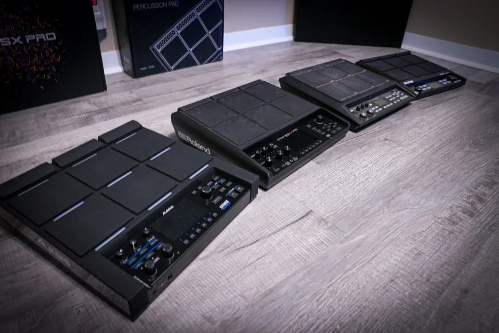 Four drum sampling pads lined up on the floor, Roland SPD-SX PRO, Alesis Strike MultiPad, Roland SPD-SX, HXW PD-705