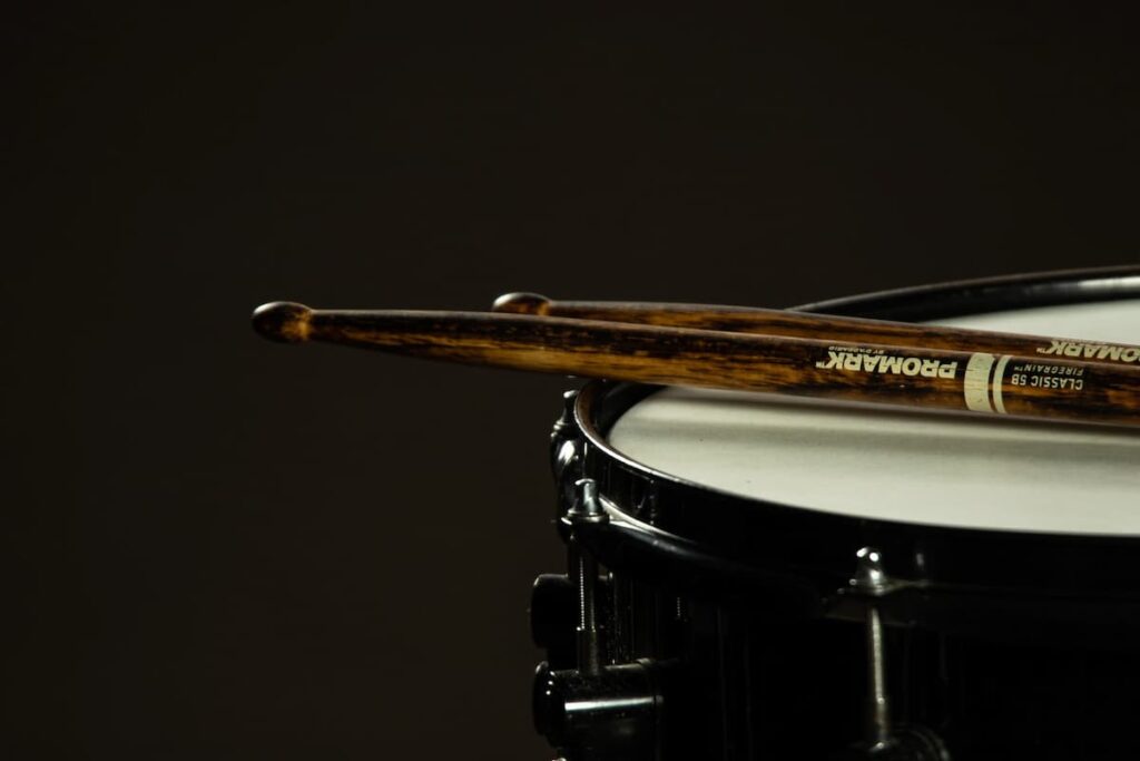 Promark drum sticks resting on a snare drum