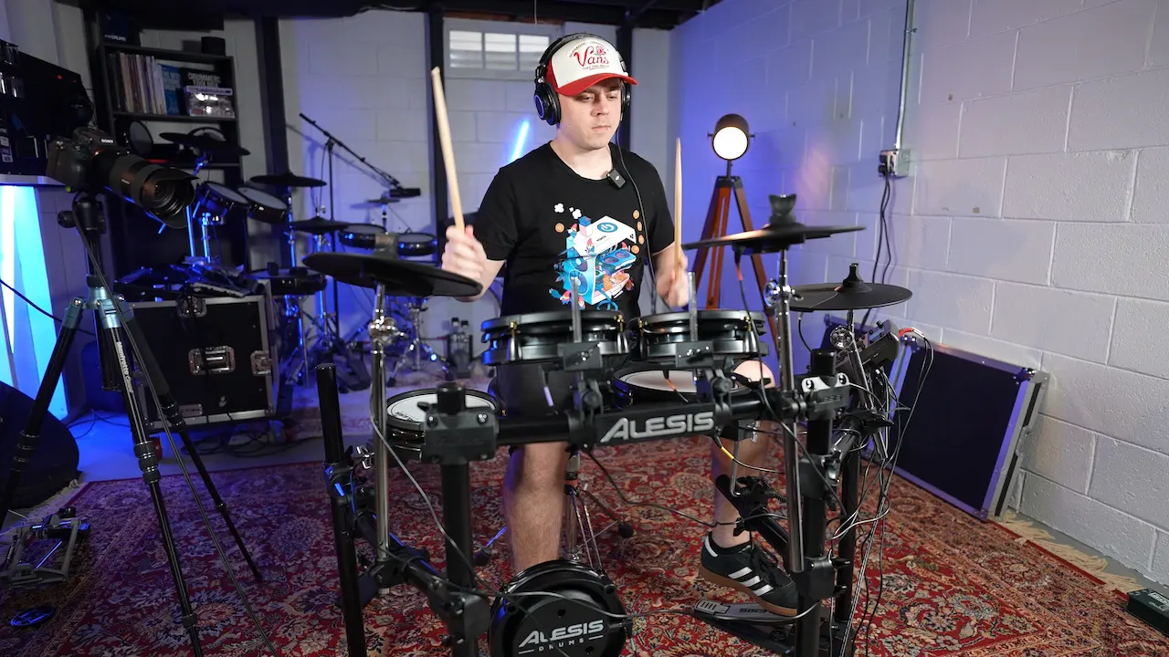 Nick Cesarz playing the Surge Mesh in a drum studio